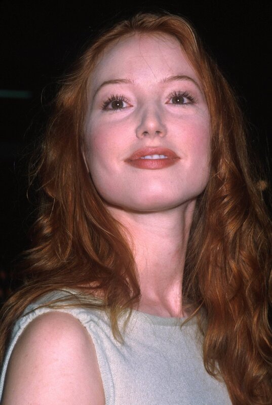 woman with red hair smiling