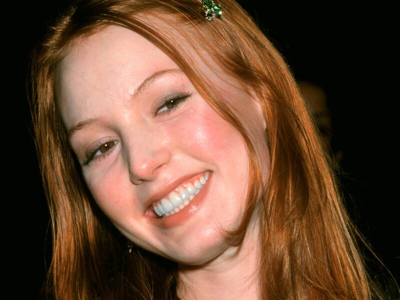 woman with red hair smiling
