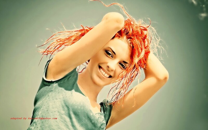 woman with red hair smiling