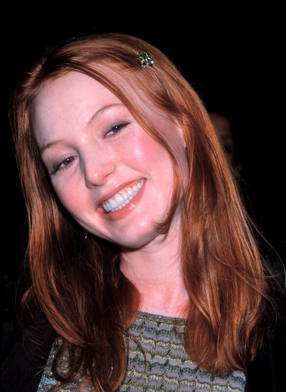 woman with red hair smiling