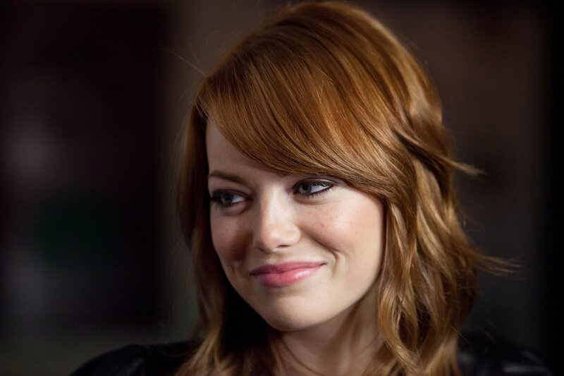 woman with red hair smiling