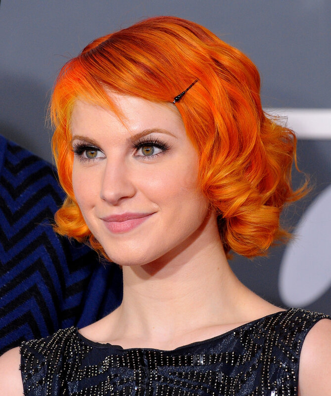 woman with red hair smiling