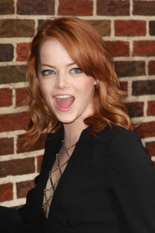 woman with red hair smiling