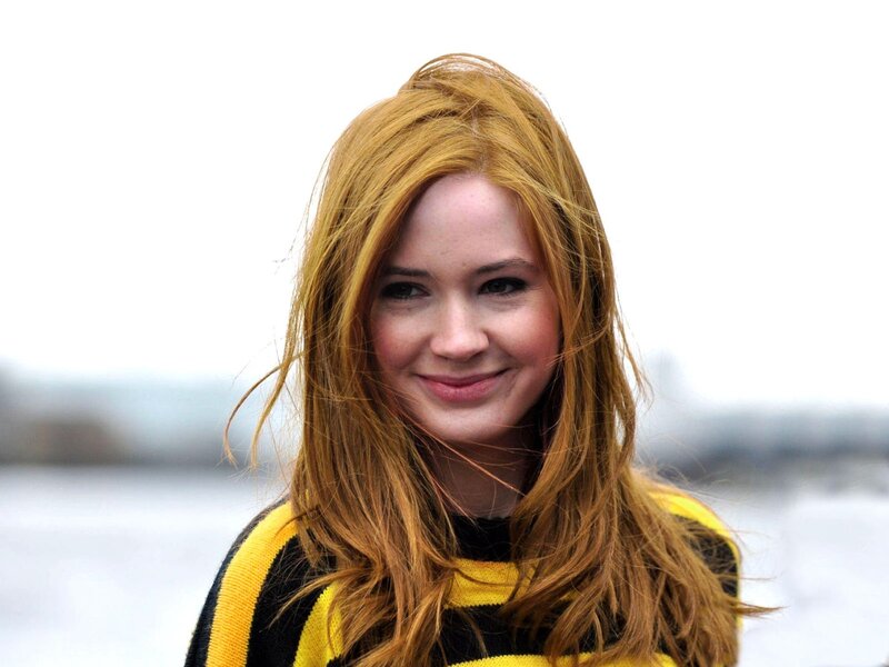 woman with red hair smiling