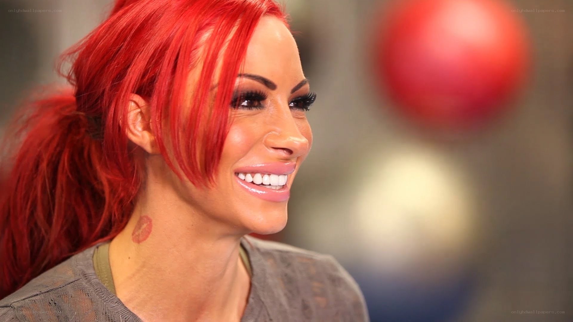 woman with red hair smiling
