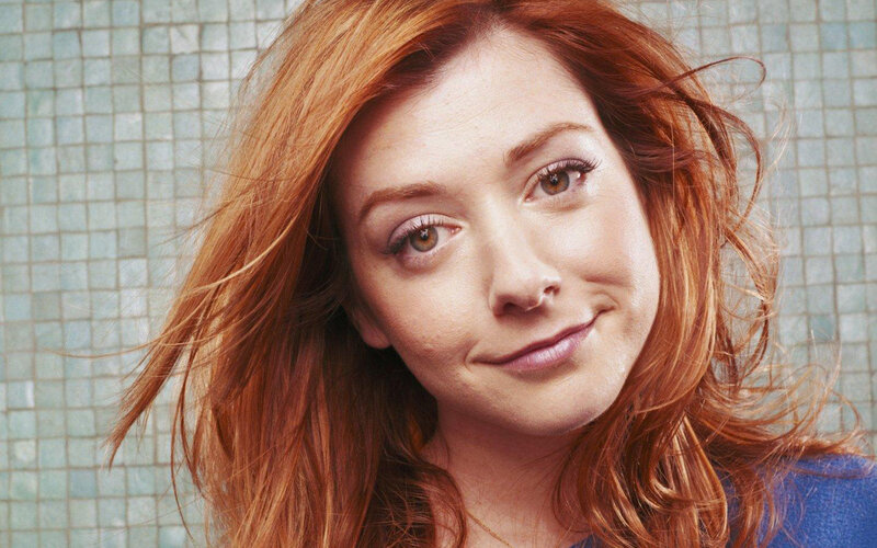 woman with red hair smiling