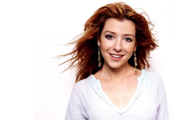 woman with red hair smiling