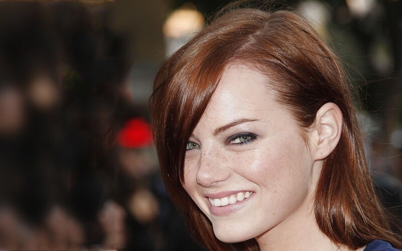 woman with red hair smiling