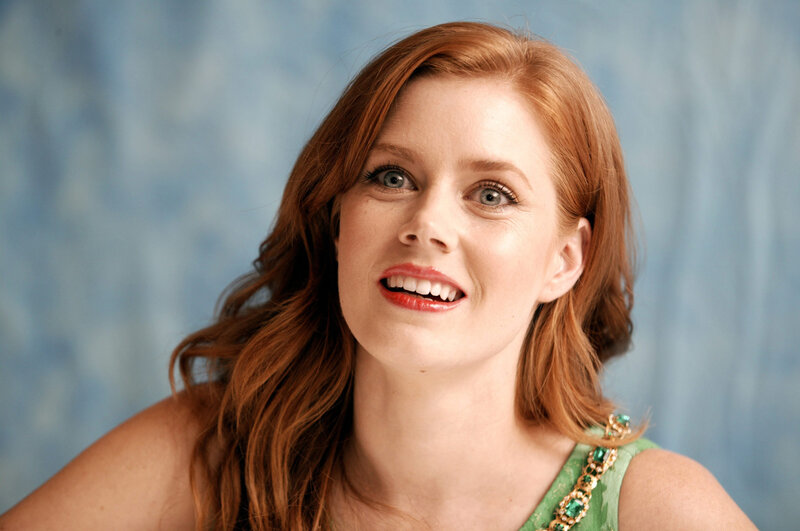 woman with red hair smiling
