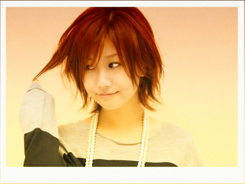 woman with red hair smiling