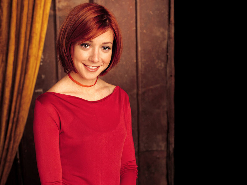 woman with red hair smiling