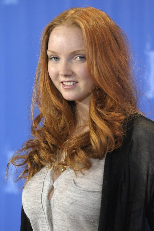 woman with red hair smiling