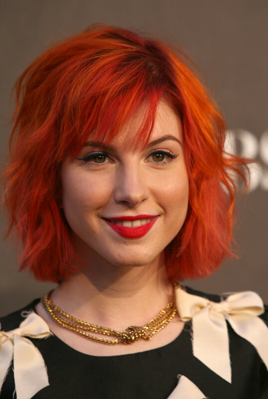 woman with red hair smiling