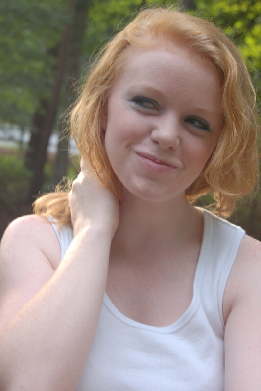 woman with red hair smiling