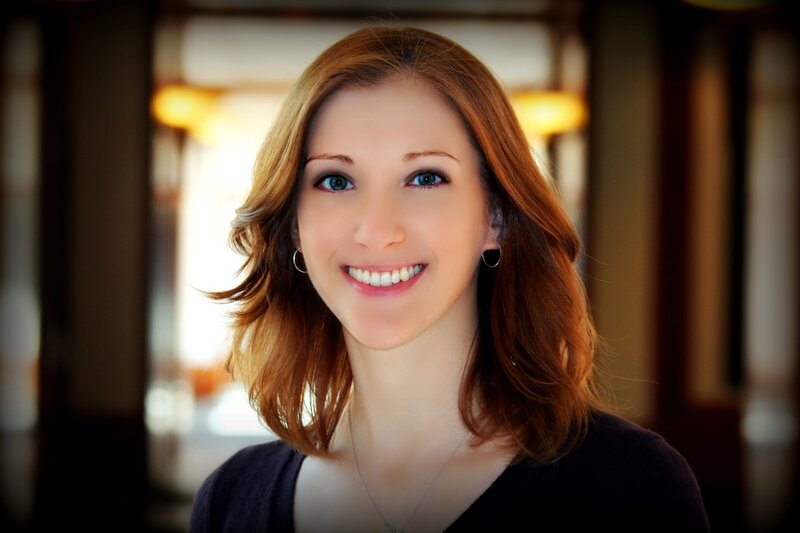 woman with red hair smiling