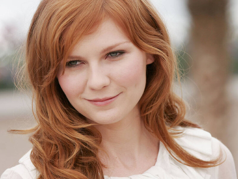 woman with red hair smiling