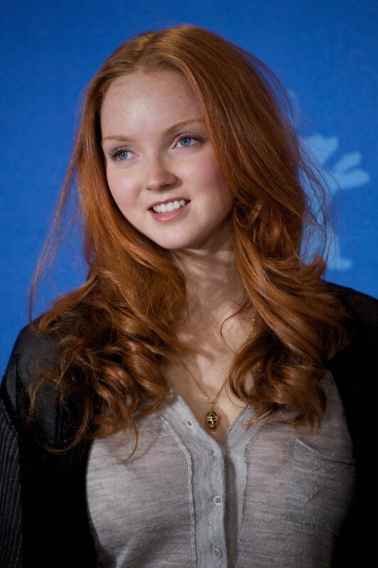 woman with red hair smiling