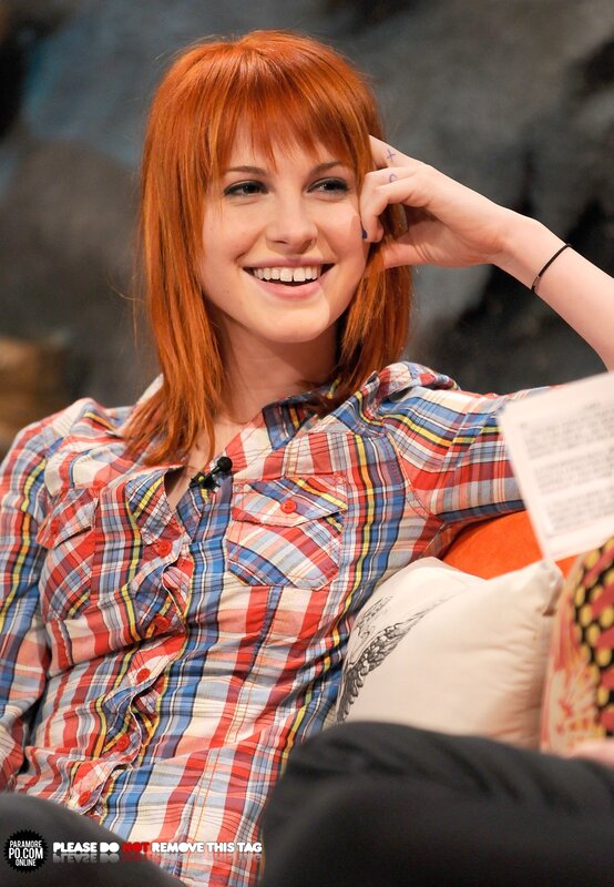 woman with red hair smiling