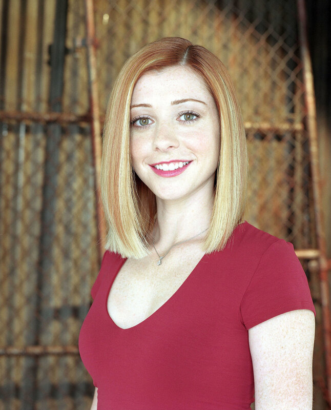 woman with red hair smiling