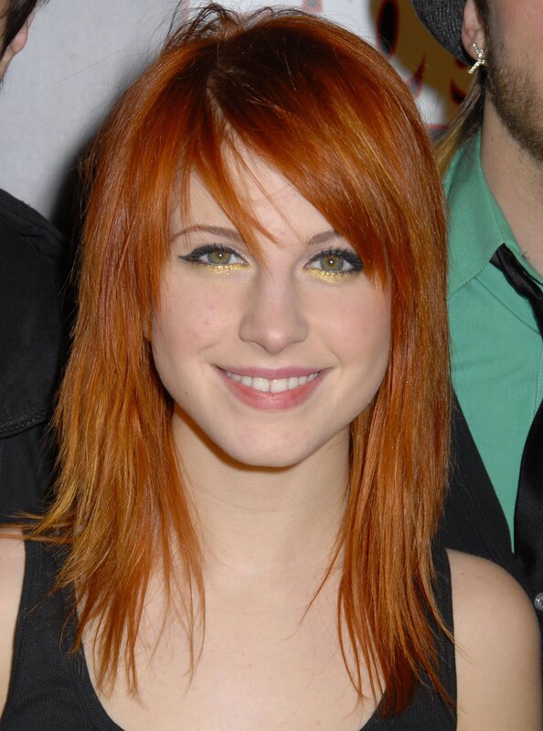 woman with red hair smiling