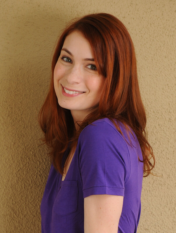 woman with red hair smiling