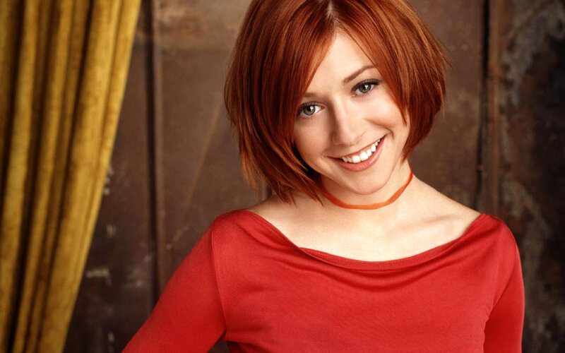 woman with red hair smiling