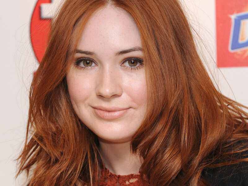 woman with red hair smiling
