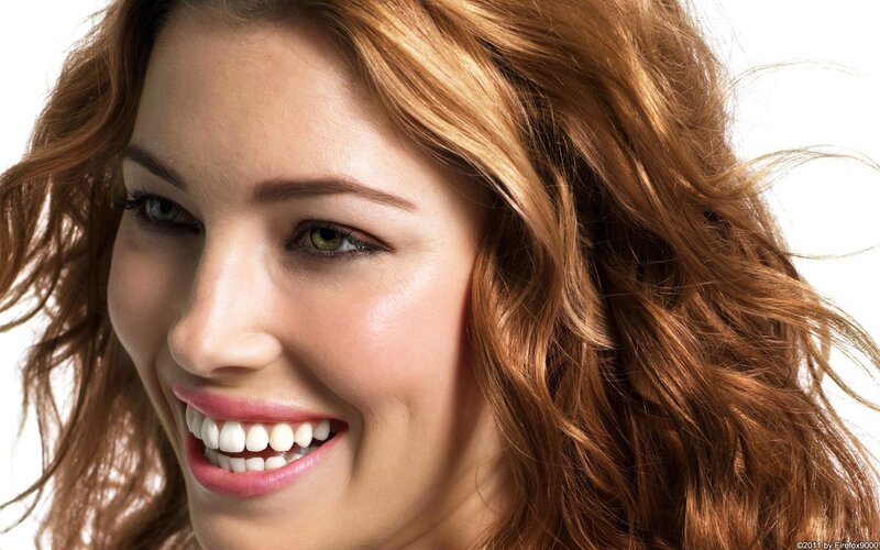 woman with red hair smiling