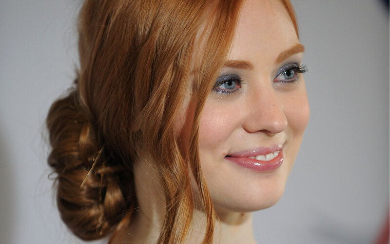 woman with red hair smiling