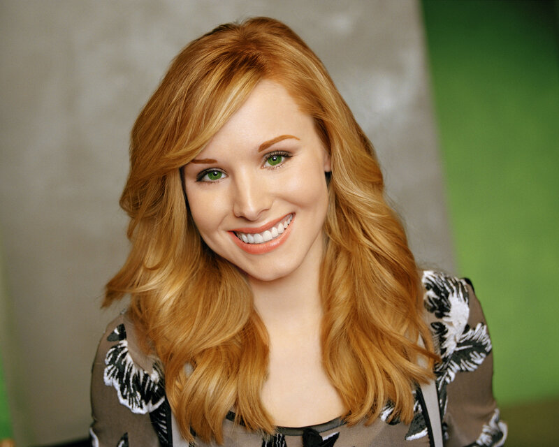 woman with red hair smiling