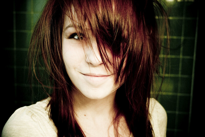 woman with red hair smiling