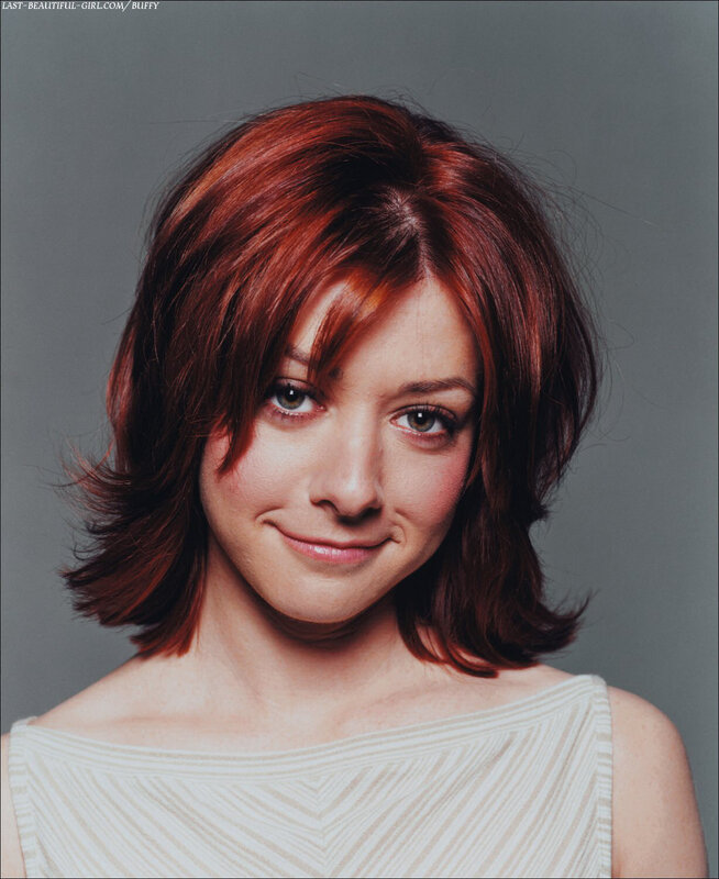woman with red hair smiling
