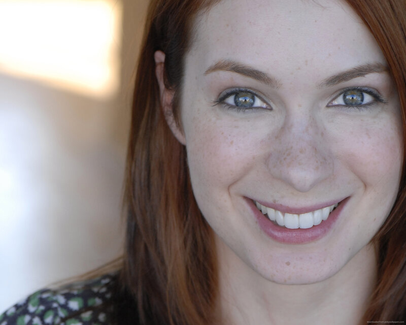 woman with red hair smiling