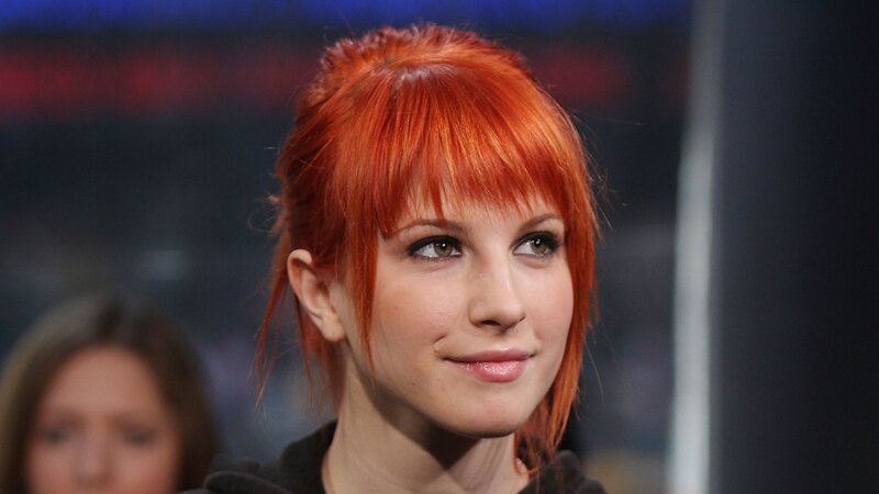 woman with red hair smiling