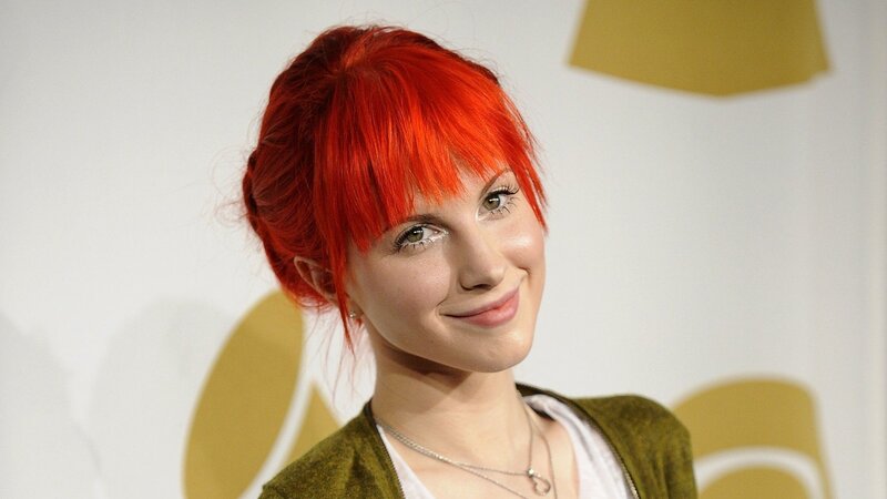 woman with red hair smiling