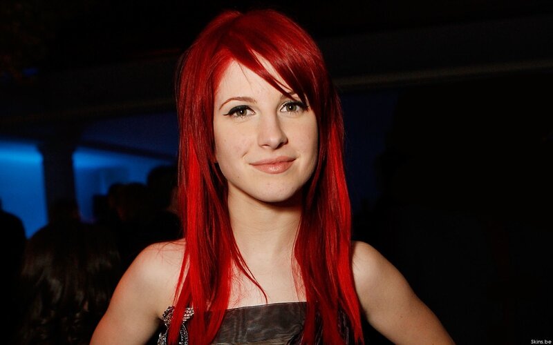 woman with red hair smiling