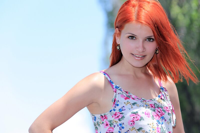 woman with red hair smiling