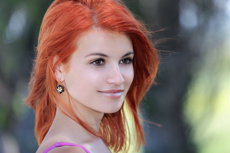 woman with red hair smiling
