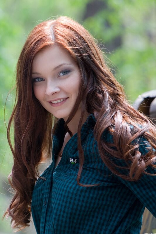 woman with red hair smiling