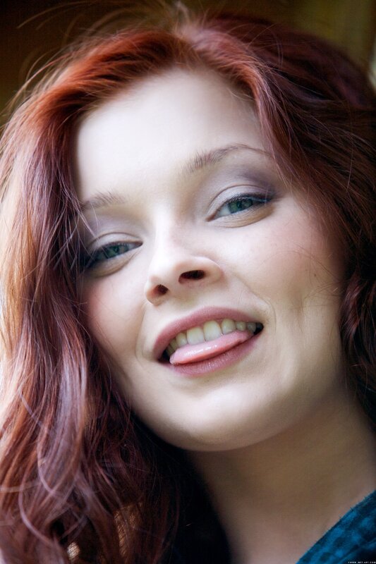 woman with red hair smiling