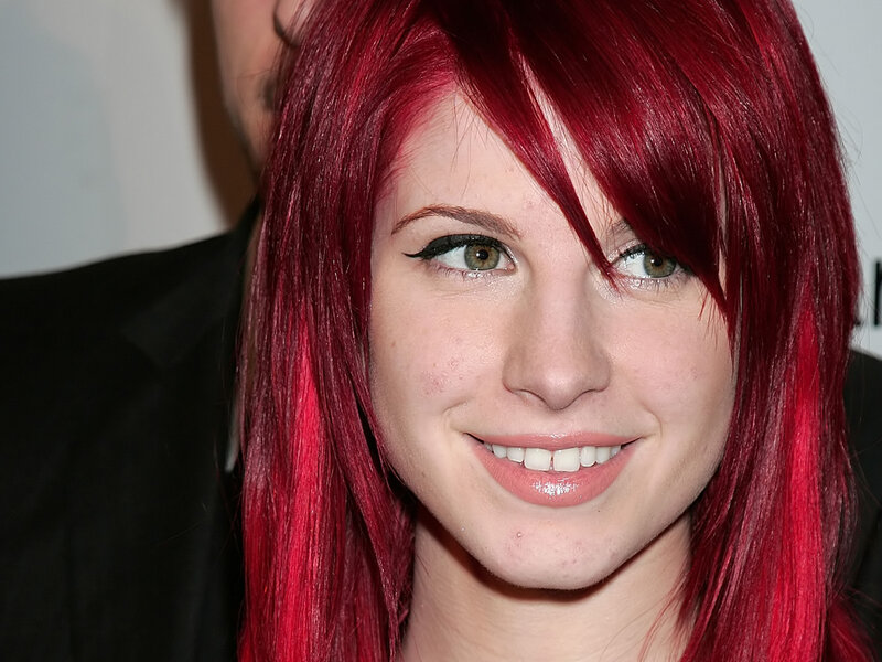 woman with red hair smiling