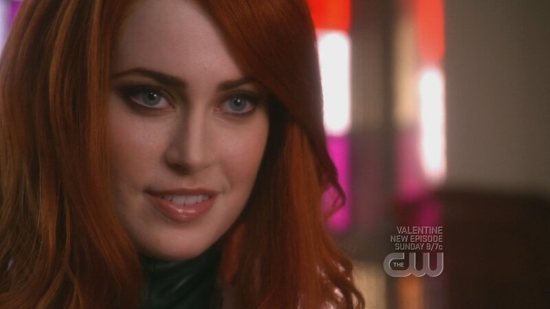 woman with red hair smiling