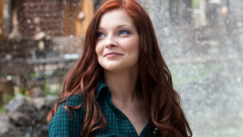 woman with red hair smiling