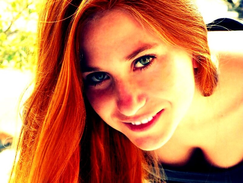 woman with red hair smiling