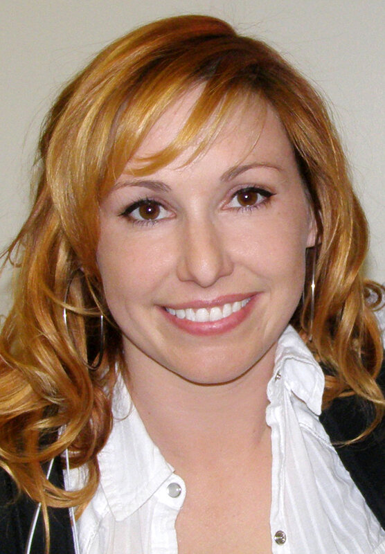 woman with red hair smiling