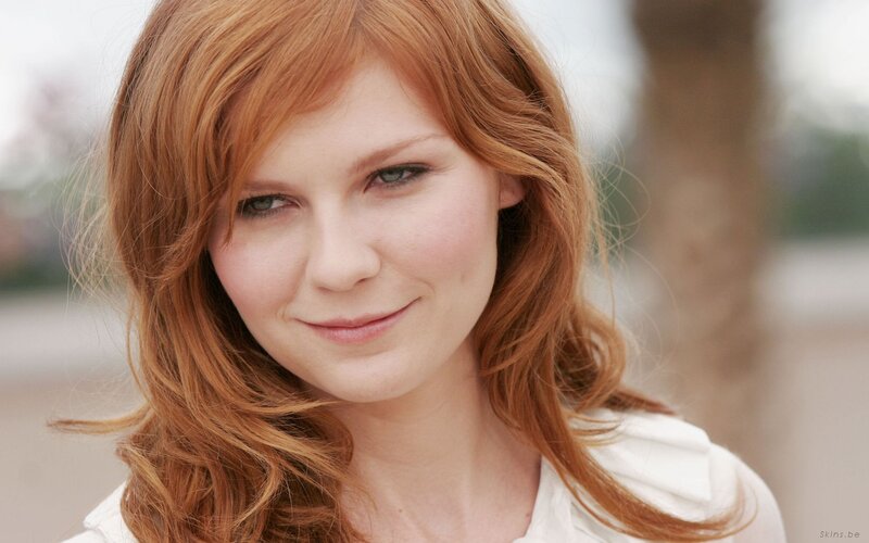 woman with red hair smiling