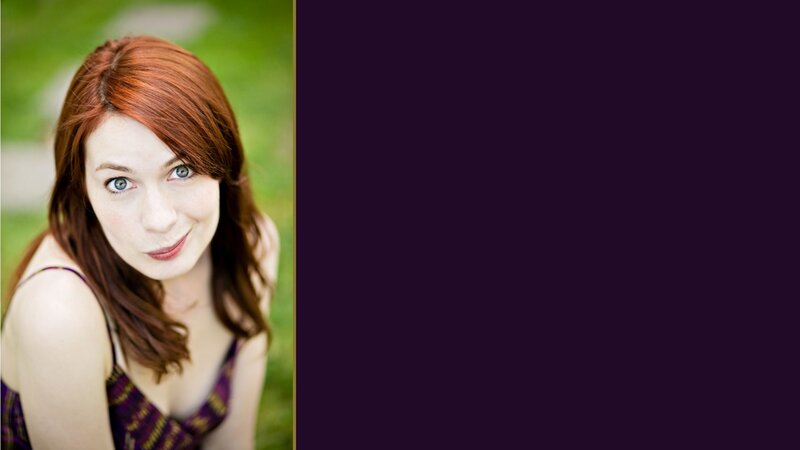 woman with red hair smiling