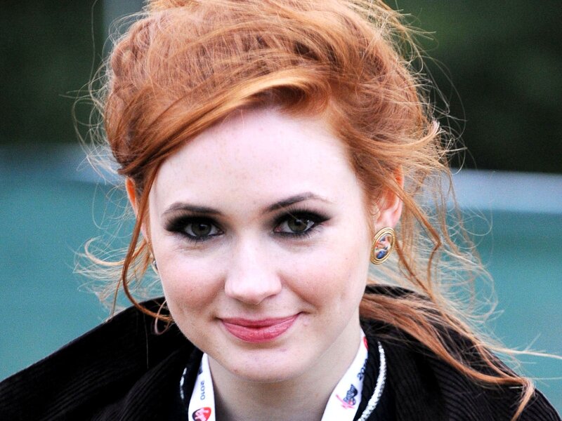 woman with red hair smiling