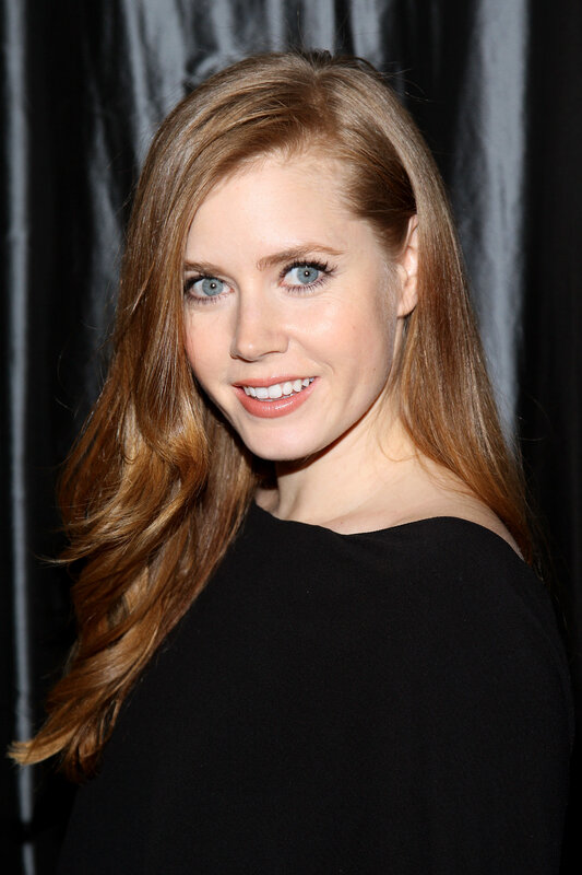 woman with red hair smiling