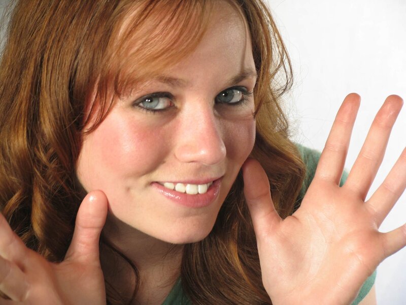 woman with red hair smiling